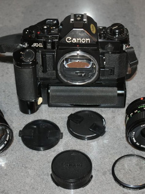 Canon A-1 collectible pack like new with Motor Drive, strap and 35mm f/2.8, 135mm lenses