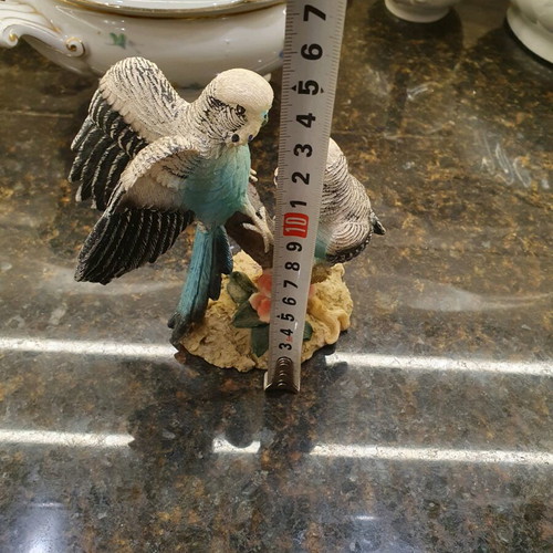 Figurine of two beautiful parrots on a branch like new