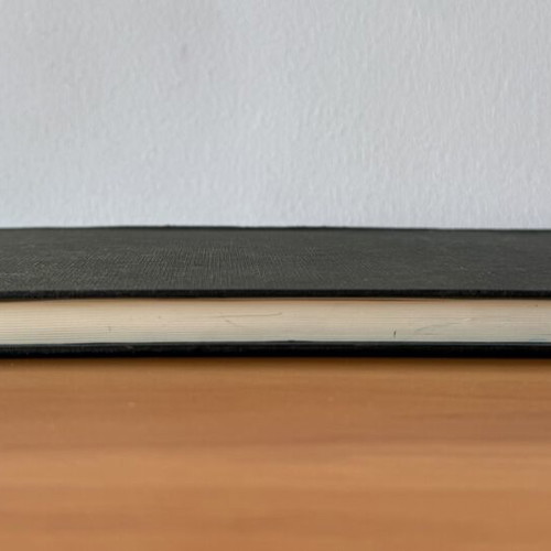Black sketchbook with fabric cover, 127 sheets