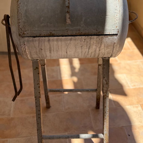 Handmade metal BBQ grill with lid used, industrial style