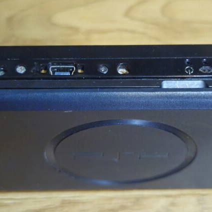 Sony PSP Street E1004 console with 8 top games and new charger