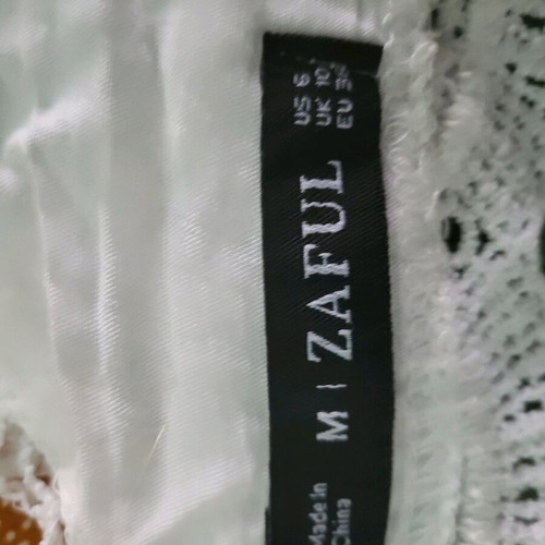 White top with cords like new, size M
