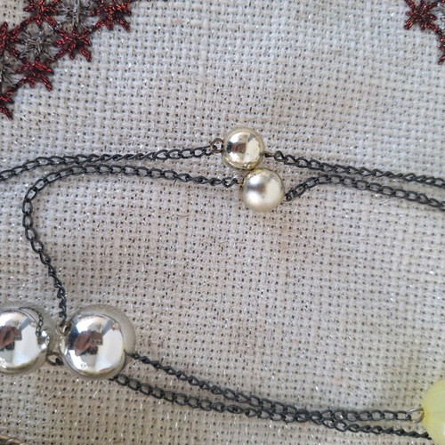 Long necklace new with feathers and yellow beads