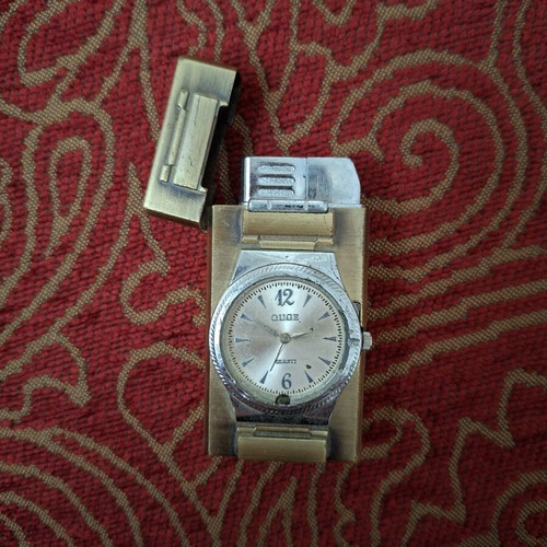 Vintage lighter with integrated quartz watch used