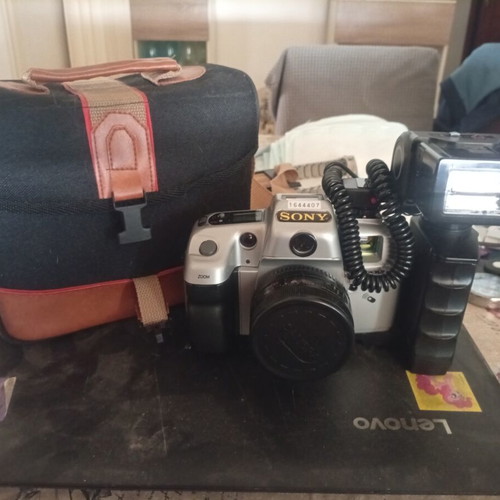 Sony camera new with flash and film, includes case