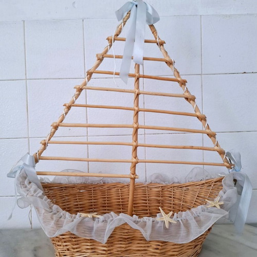 Large wicker basket in sailboat design used