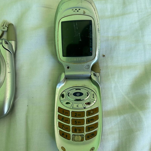 Samsung T100 phone set used, one works, one for parts