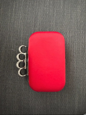 Red clutch like new with decorative clasp and chain