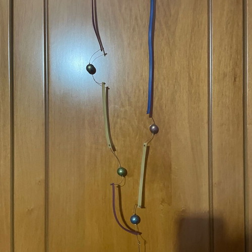 Long necklace used with gold-plated multicolor beads and plastic parts