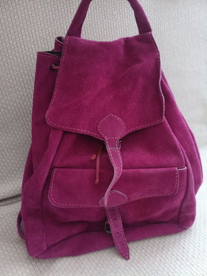 Leather backpack fuchsia used with some wear