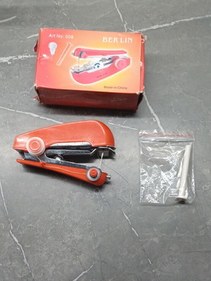 Mini handheld sewing machine like new, portable manual