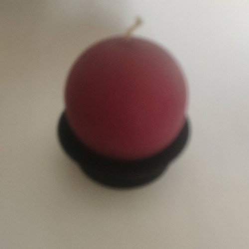 Round candle on metal black base like new