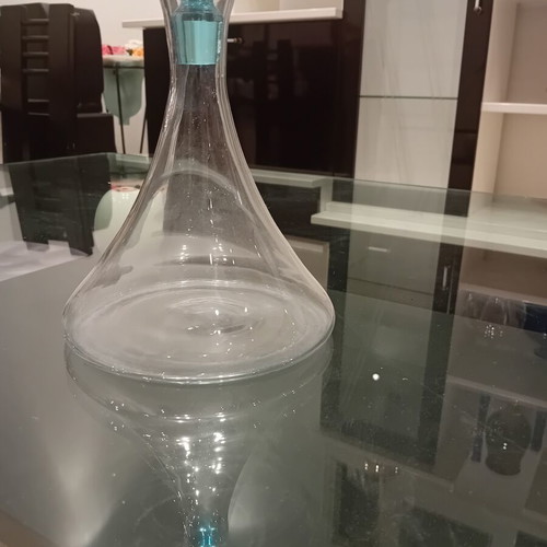 Glass carafe with turquoise spherical stopper, used