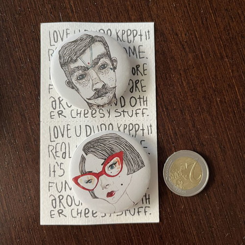 Two new unused pins, white and red