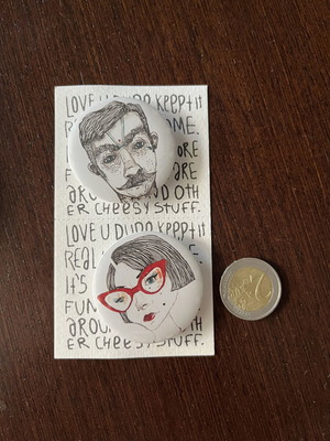 Two new unused pins, white and red