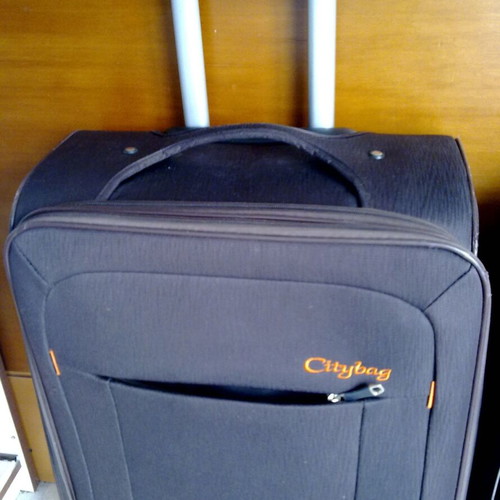 Wheeled travel suitcases, black and grey, like new