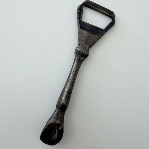 Brass beer opener with horse leg and horseshoe end used