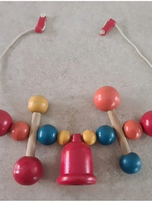 Vintage wooden stroller toy.