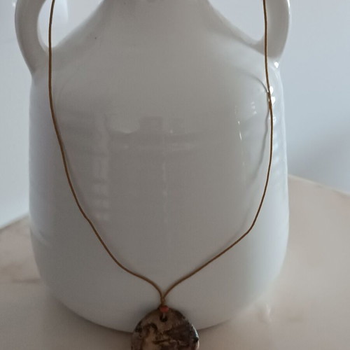 Ceramic handmade necklace like new with embossed dove and cord