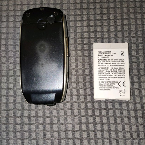 Sharp GX25 used black mobile phone with wear marks