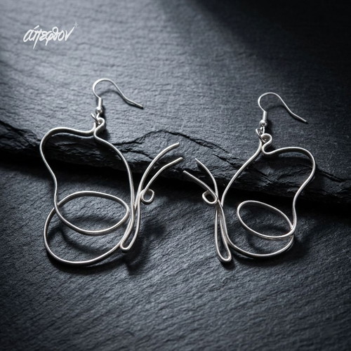 Lunar Chrysalis earrings new, asymmetrical silver butterflies