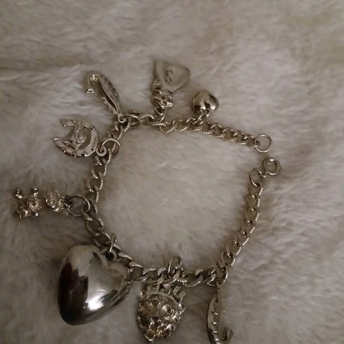 Silver bracelet with charms like new