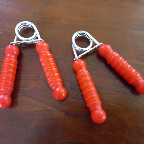 Set of 2 hand grip strengtheners used, red
