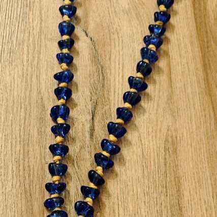 Tabletop komboloi with blue and gold glass beads