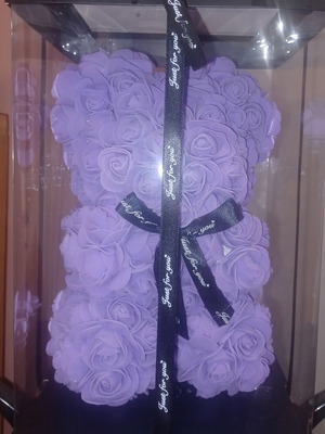 Bear with purple flowers new from artificial roses