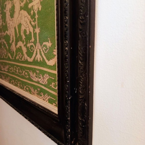 Handmade embroidery in large black Corinthian-style frame, used