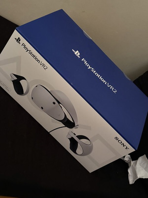 Sony PlayStation VR2 like new with headset, controllers, and charging base