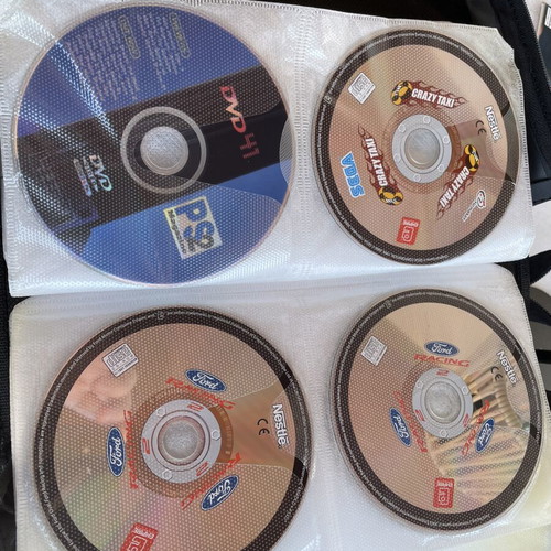 Vintage PC and PlayStation 2 gaming bundle with case, 70 CDs/DVDs