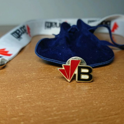 Pin and keyring new with blue pouch