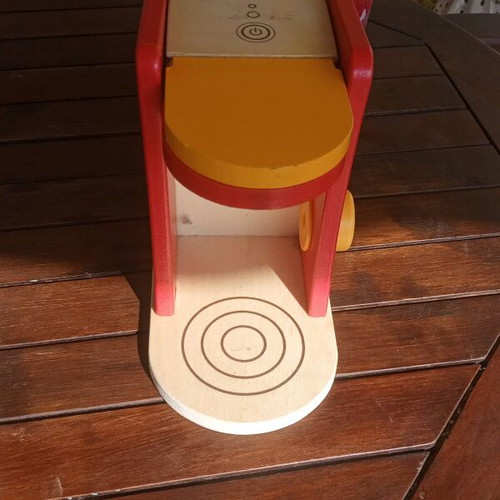 Wooden coffee maker toy used with plastic cups and milk jug