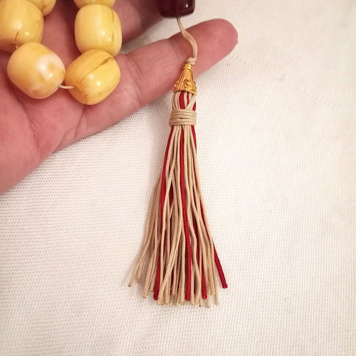 Worry beads with synthetic resin beads in yellow and burgundy, like new