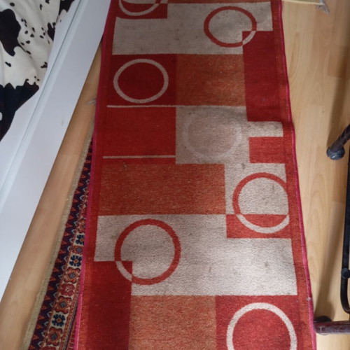 Vintage carpet runner used with geometric motifs in warm colors