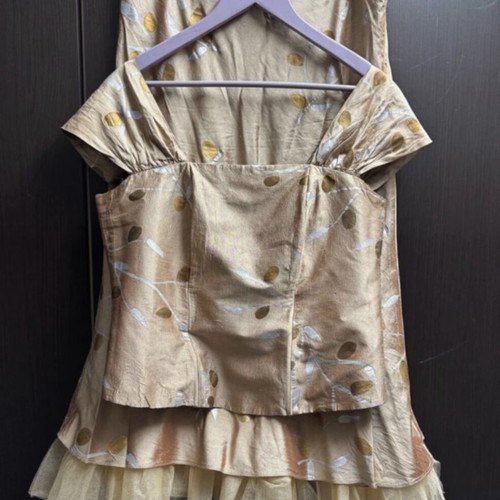 Gold blouse and skirt set with leaf pattern and tulle hem