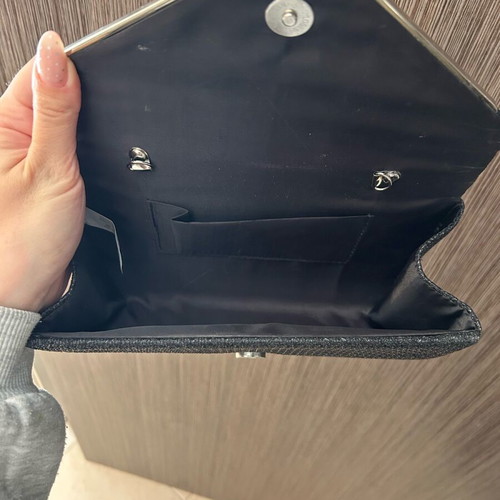Black clutch handbag like new with embossed texture