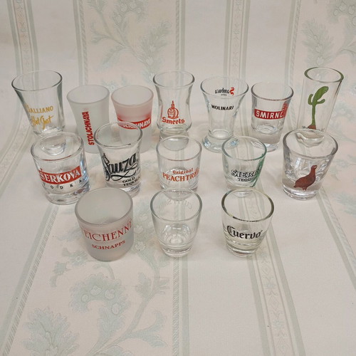 Collection of 87 shot glasses new, promotional and collectible