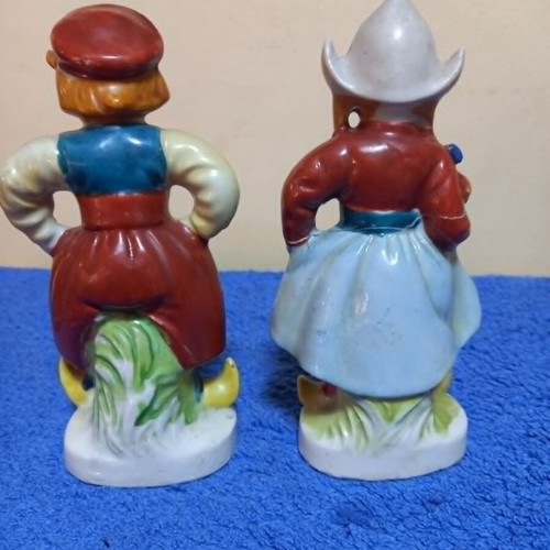 Porcelain figurines used, boy and girl in traditional Dutch costume