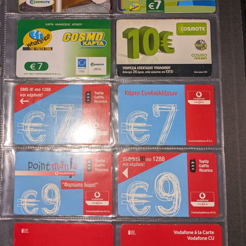 Black folder like new with 25 phone cards and cards