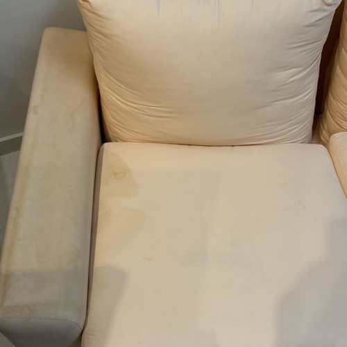 Three-seater fabric sofa used, light pink-peach color with side cushions
