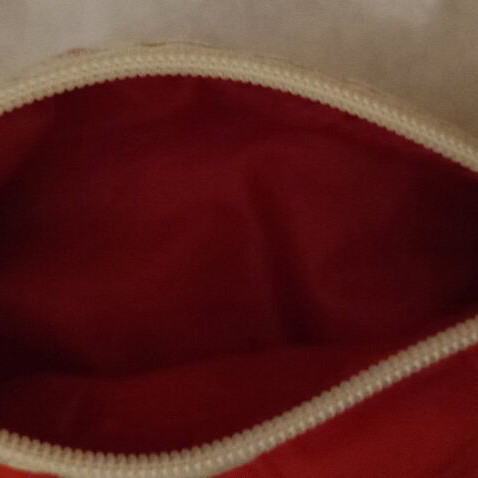 Toiletry bag used red with white stripe