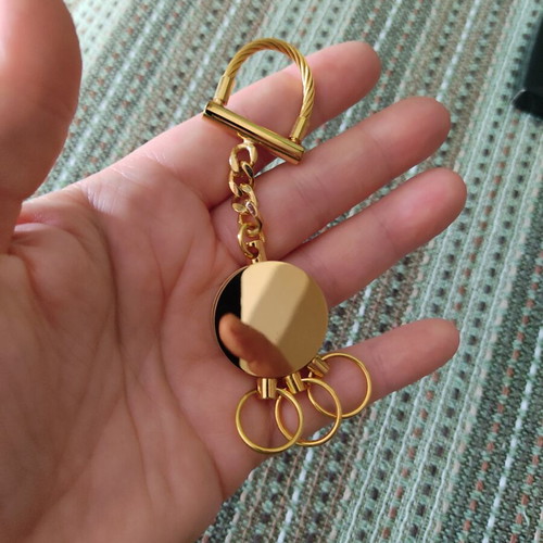 Deluxe keychain with case, like new, gold tone