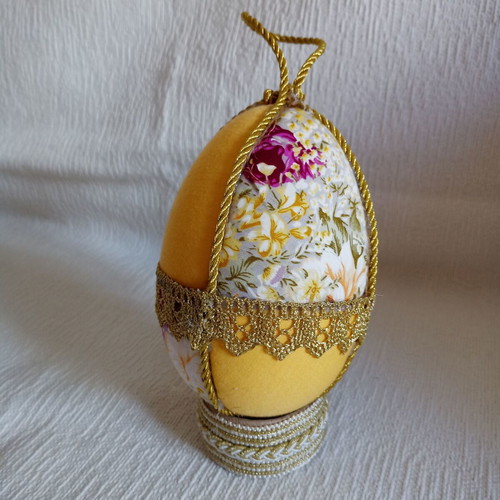 Decorative yellow floral egg used for Easter and spring decor