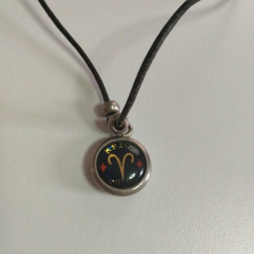 Necklace with Aries zodiac sign like new, pendant with cord