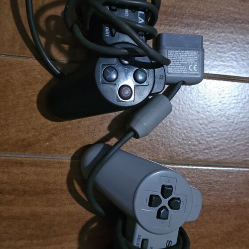 PlayStation 1 console with 2 controllers
