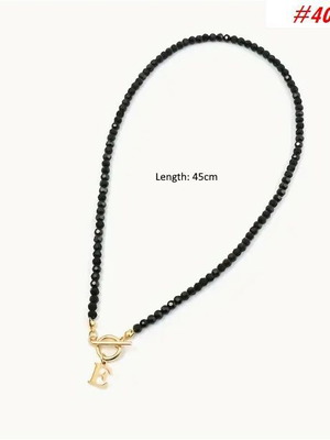 Necklace with letter E gold color new