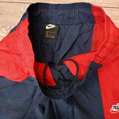 Nike track pants used, navy with red stripes