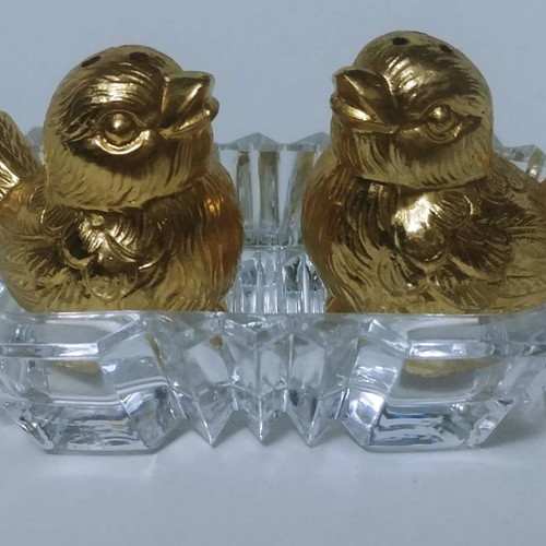 Set of gilded miniature salt and pepper shakers with lead tray